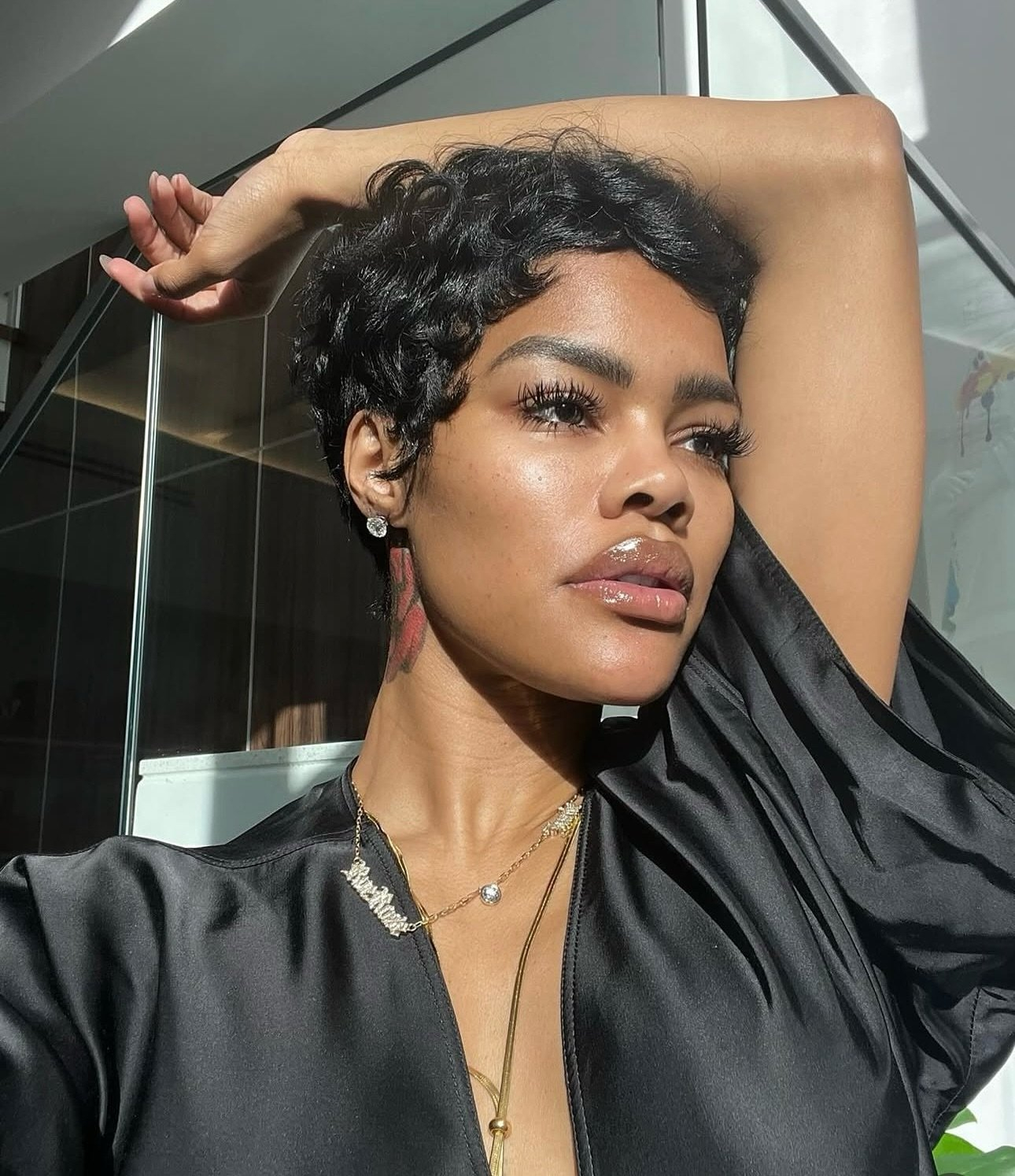 Woman with pixie cut and natural makeup.