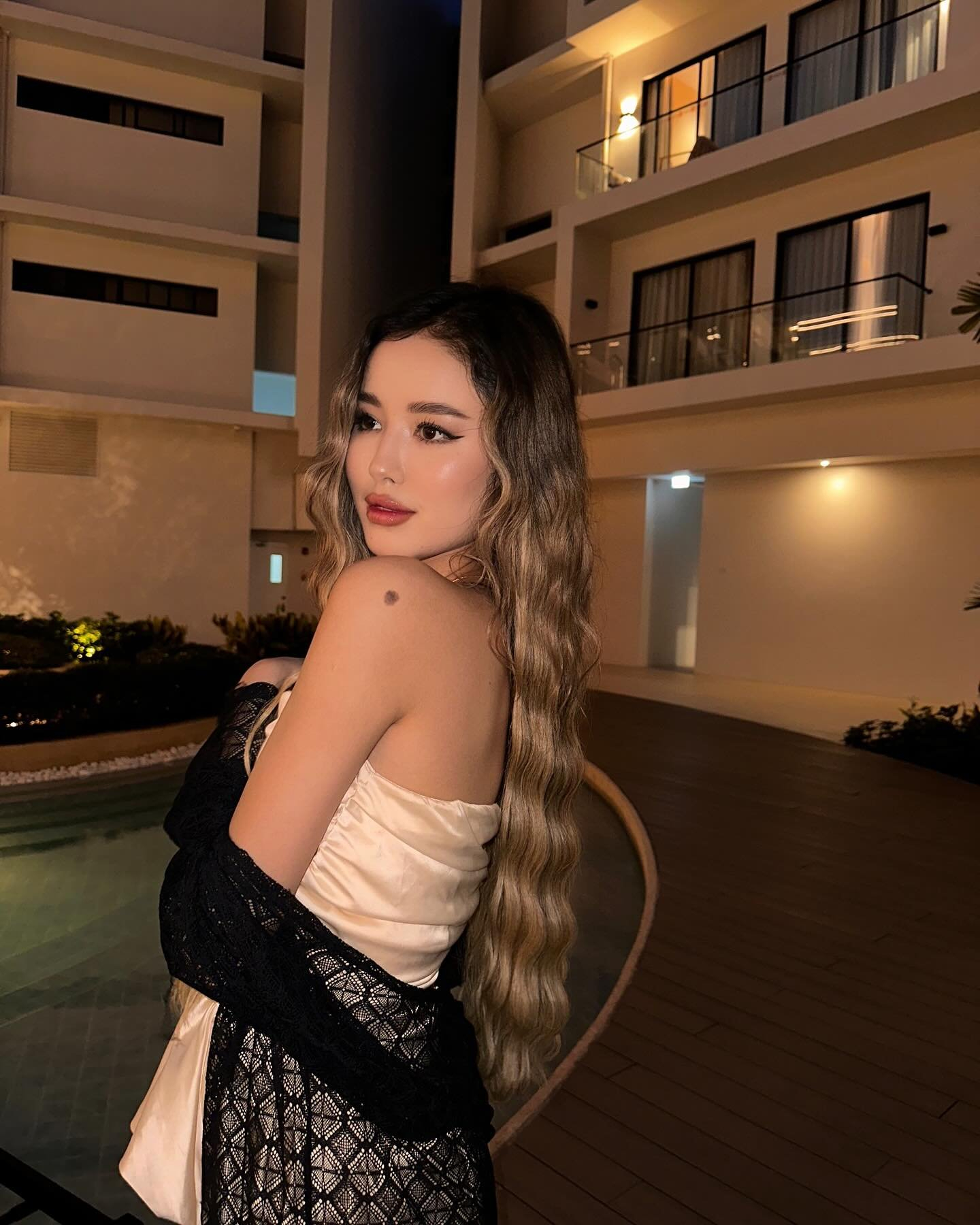 Woman in white dress with black lace.
